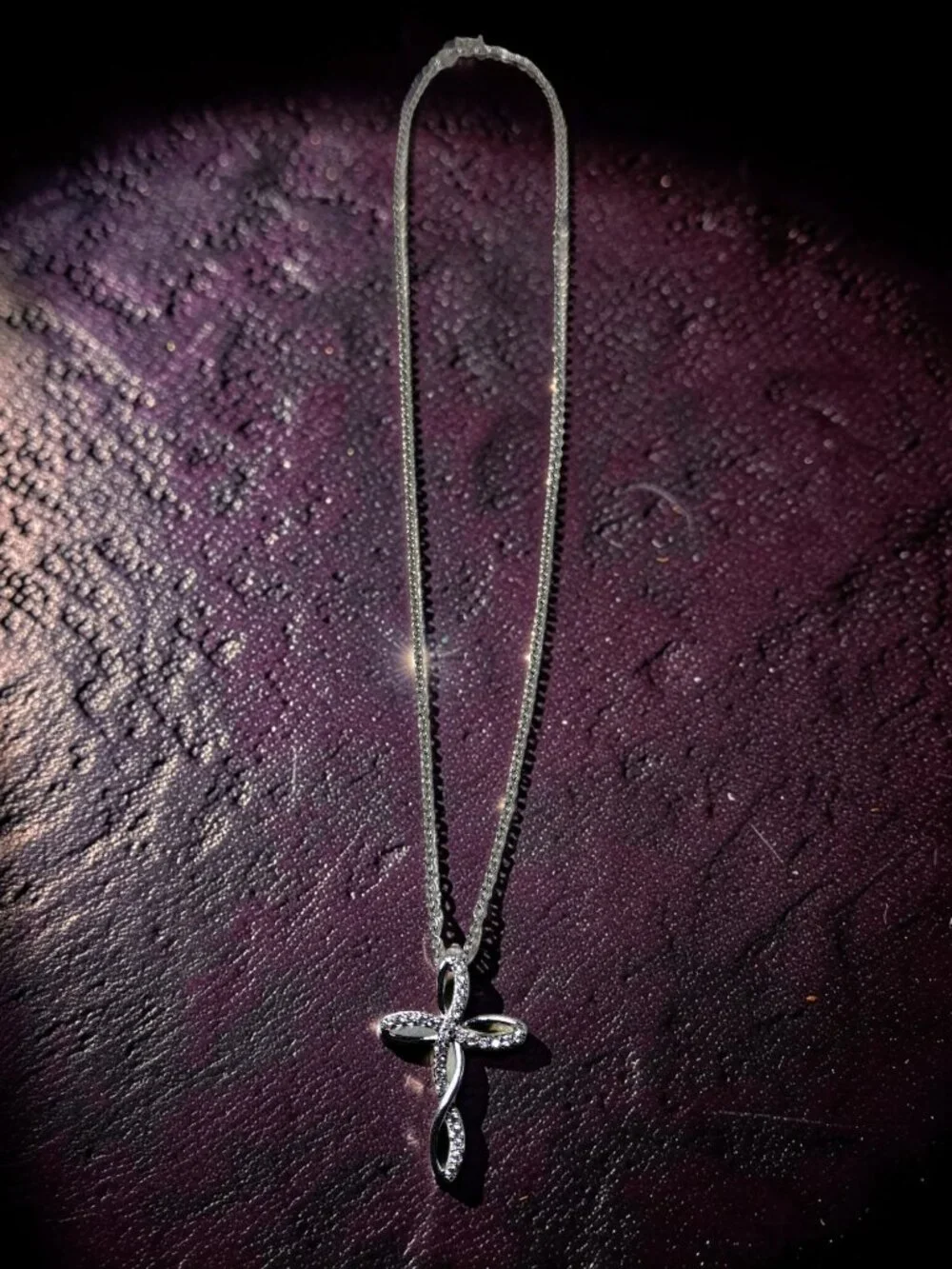vintage Chrystal lined spiraled curled cross on a .925 sterling necklace